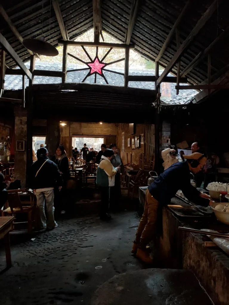 Guanyinge Old Teahouse in Pengzhen Chengdu with historic interior, wooden tables and traditional tea