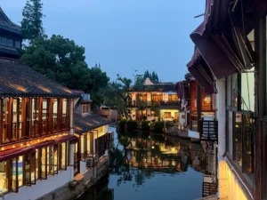 Zhujiajiao Water Town near Shanghai with traditional canal houses reflected in the water at dusk